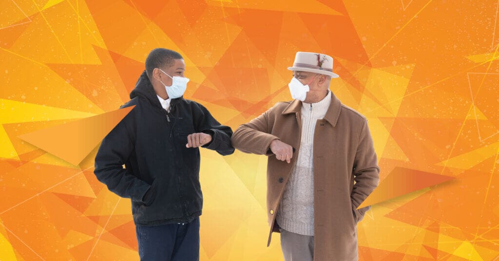 Masked male mentor and mentee pair bumping elbows