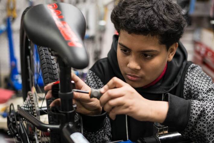 An apprentice assembles a bike at Adi's Bike Shop in Roslindale.