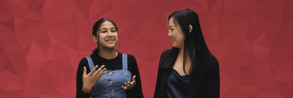 female mentor mentee pair talking with eachother